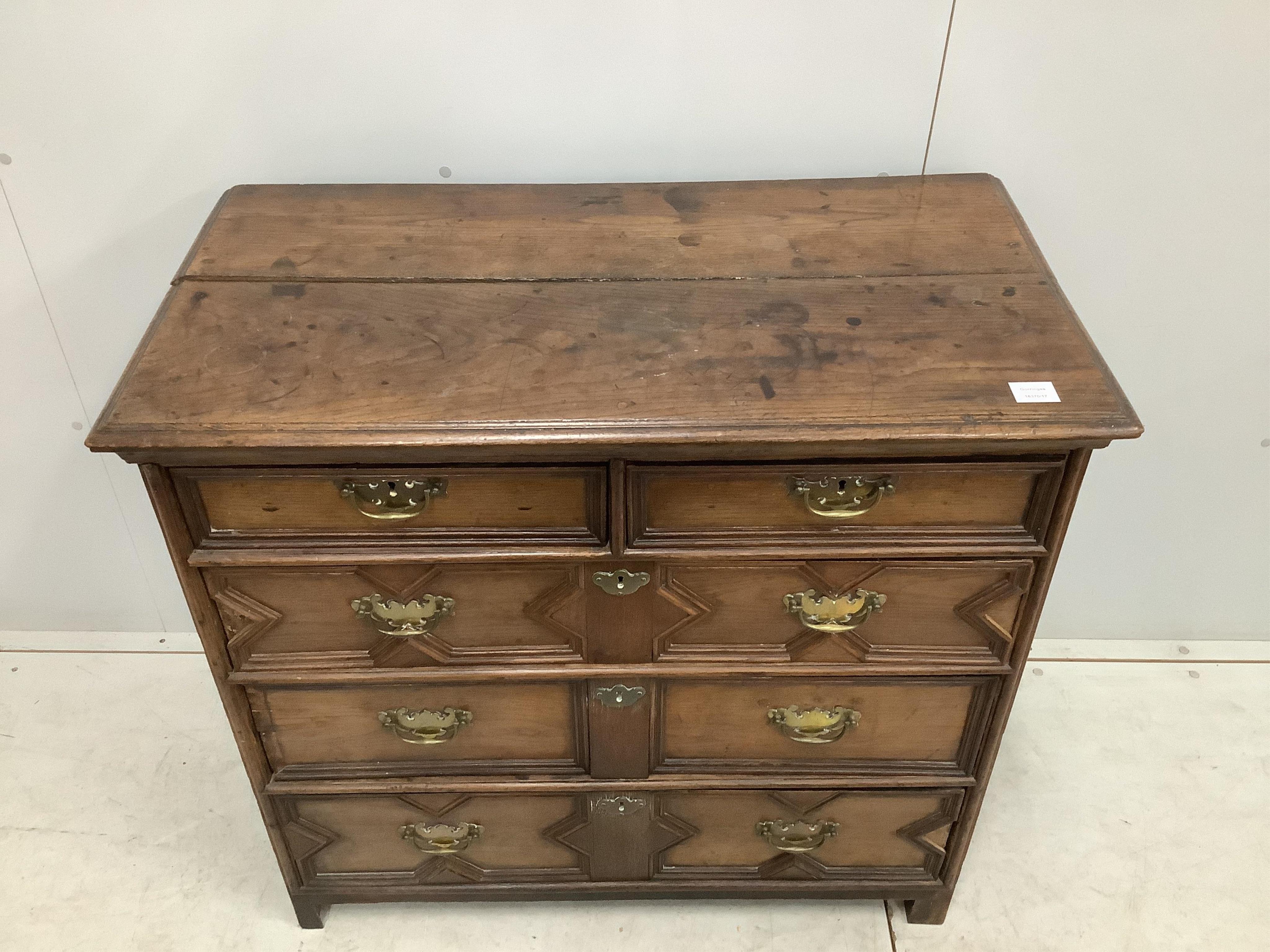 A Carolean geometric moulded oak chest of drawers, width 97cm, depth 51cm, height 91cm. Condition - poor